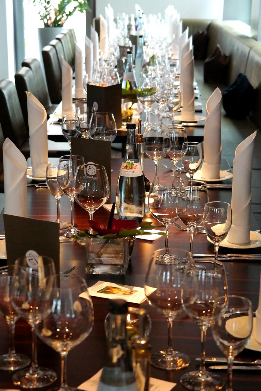 Eco-friendly event supplies including bamboo plates and compostable cutlery
